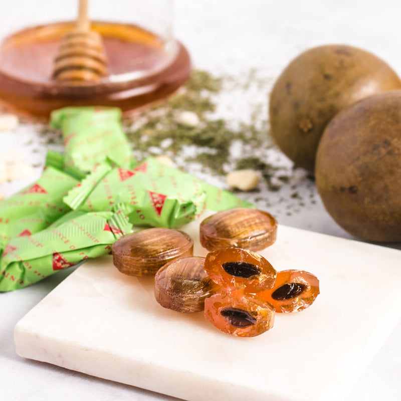 The brust inside the Prince of Peace Honey Loquat inside Candy with monk fruits in the background.